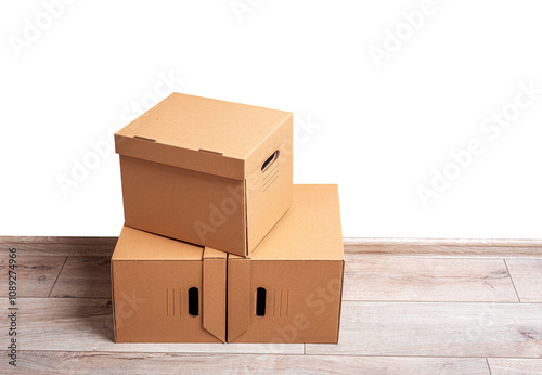 Obraz na płótnie Mailing cardboard boxes on the floor against a white wall. w salonie