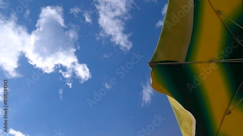 Beach umbrella on the beach at sunset.