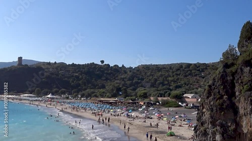 People having fun and entertaining themselves on the beach at sunset. Marina di Camerota, Salerno, Italy.
