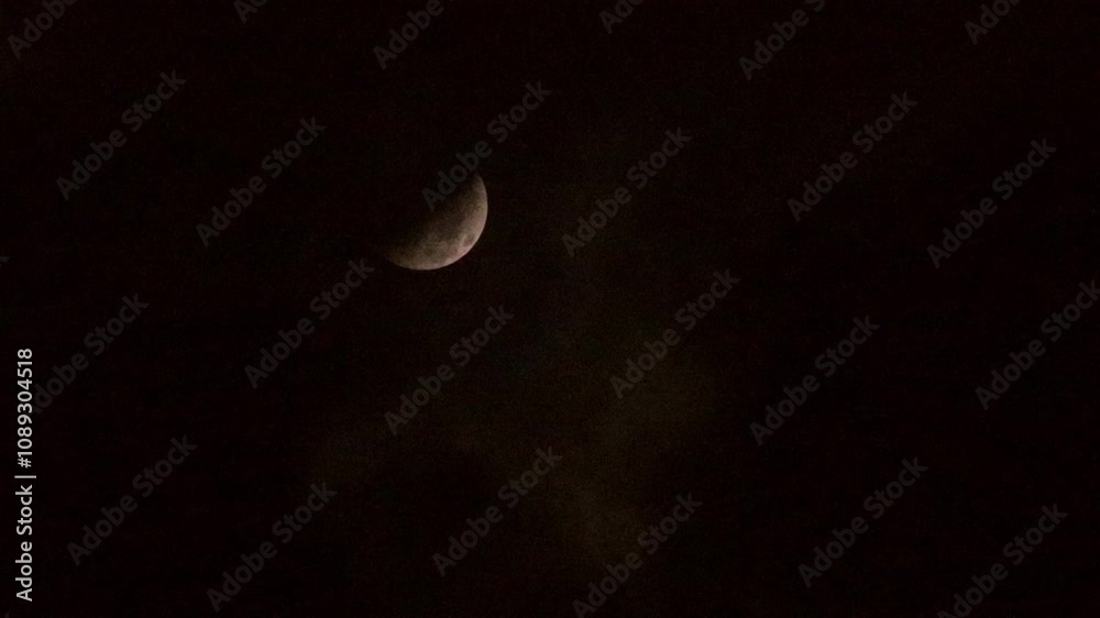 Crescent moon falling at night, dark sky background Crescent moon falling at night, dark sky background
