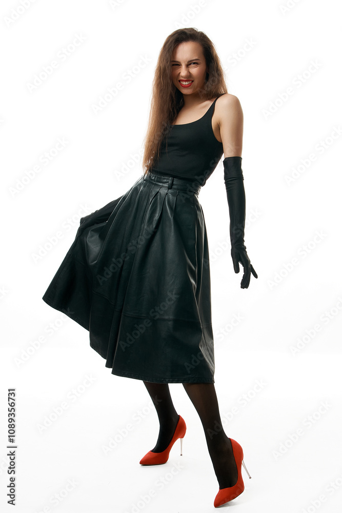 beautiful girl in black dress, gloves and red shoes poses in studio on white background beautiful girl in black dress, gloves and red shoes poses in studio on white background