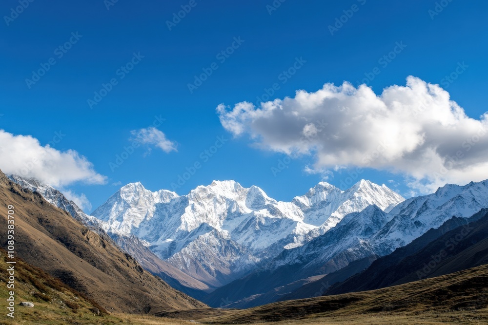 Fototapeta premium majestic snow-capped mountains under a clear blue sky