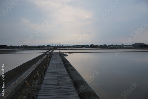 Wallpaper Mural Tranquil sunset reflection over salt pans coastal region photography serene environment aerial view nature beauty Torontodigital.ca