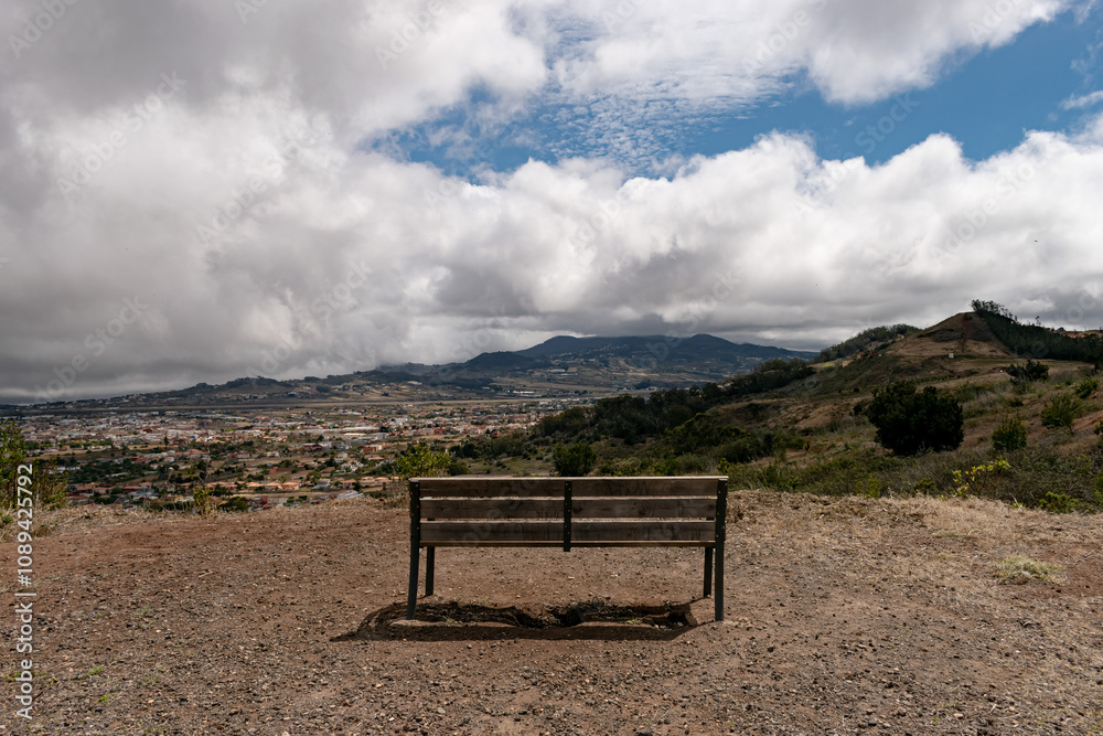 Solitary bench in an impressive natural landscape of Mesa Mota, Tenerife, Spain, with panoramic views and the beauty of Canary Islands nature Solitary bench in an impressive natural landscape of Mesa Mota, Tenerife, Spain, with panoramic views and the beauty of Canary Islands nature