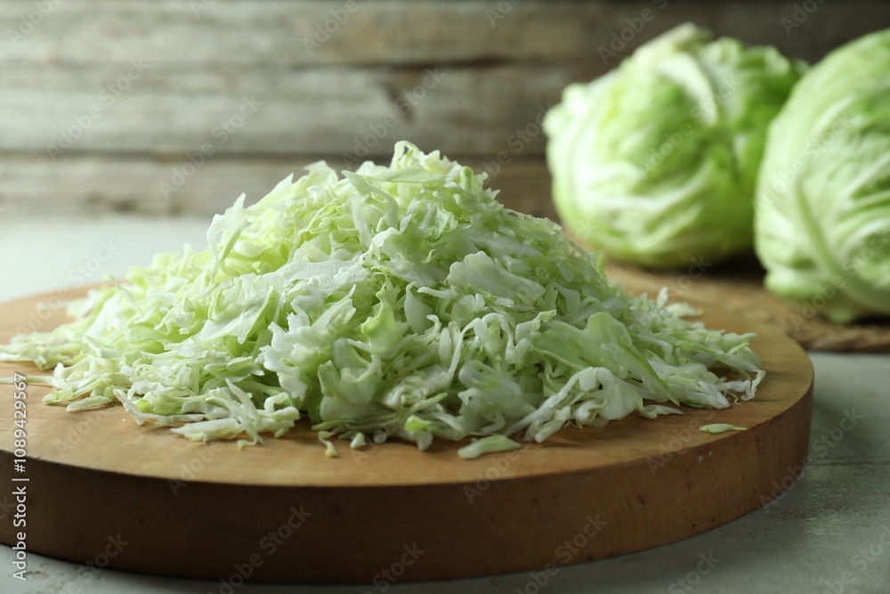 Fresh shredded cabbage on light table, closeup Fresh shredded cabbage on light table, closeup