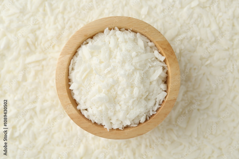 White soy wax flakes and bowl, top view White soy wax flakes and bowl, top view