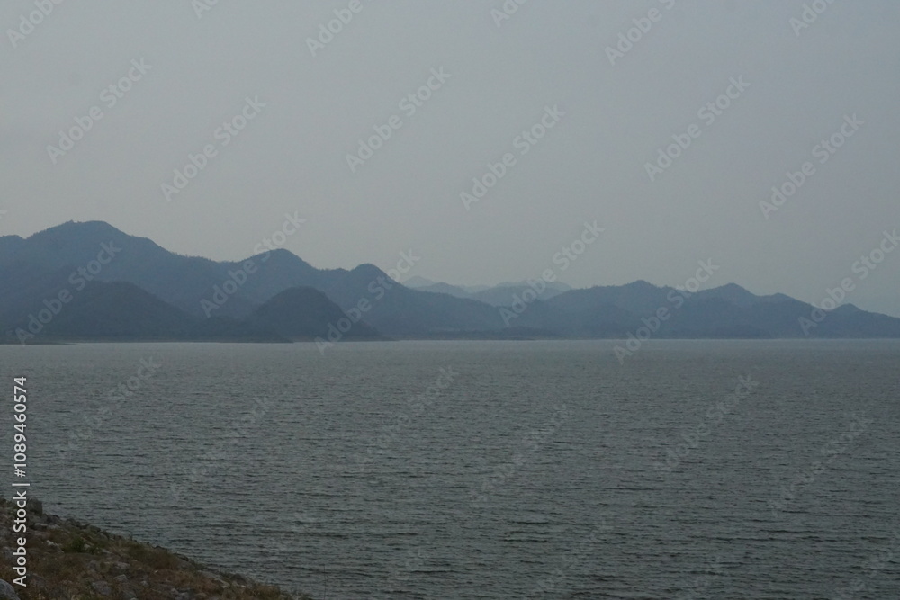 Fototapeta premium Calm water reflection serene mountain range nature landscape tranquil environment wide angle view peaceful concept for relaxation
