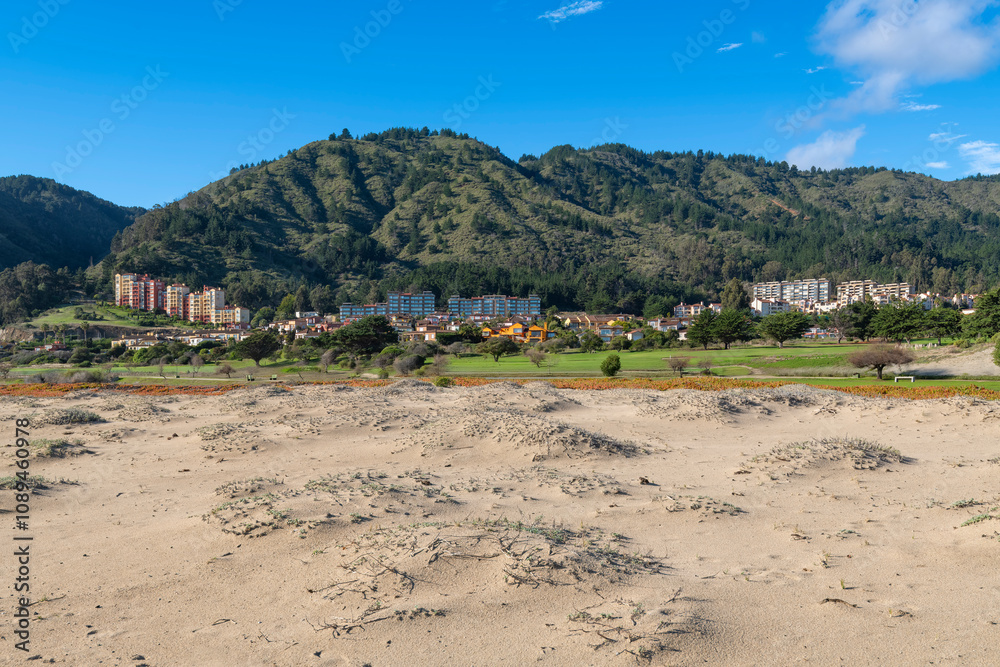 Panoramic view of the beach apartment buildings at beach resort town of Quintay, V Region, Chile Panoramic view of the beach apartment buildings at beach resort town of Quintay, V Region, Chile