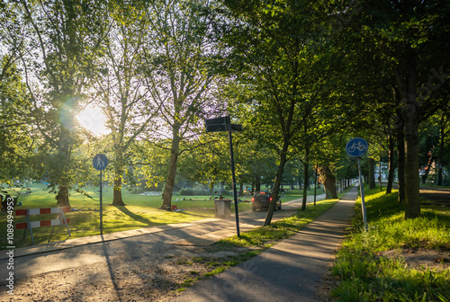 People enjoy picnic on grass at a park in Rotterdam Netherlands.