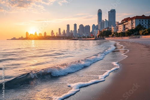 Qingdao beach scene with waves gently lapping the shore, the modern skyline visible in the background under soft sunlight