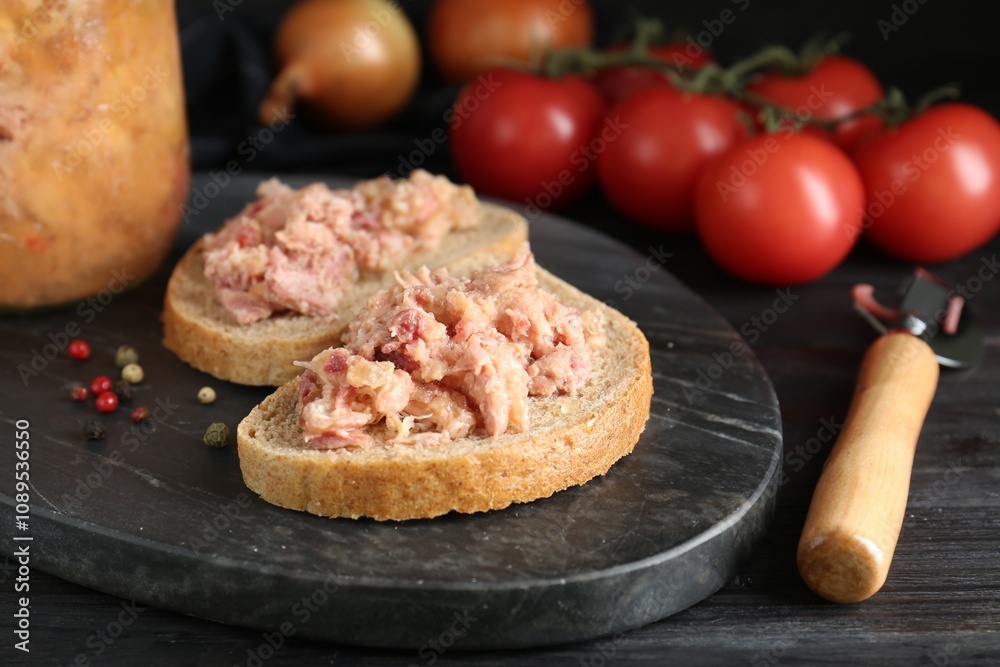 Sandwiches with canned meat and opener on wooden table, closeup Sandwiches with canned meat and opener on wooden table, closeup