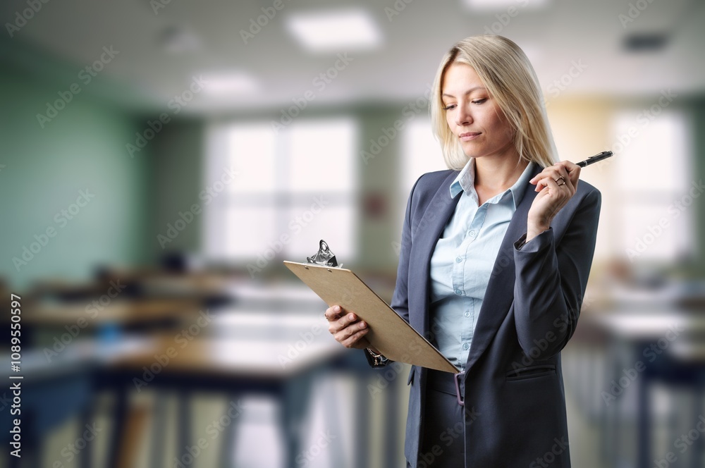 Teacher or businesswoman present the work in class room Teacher or businesswoman present the work in class room
