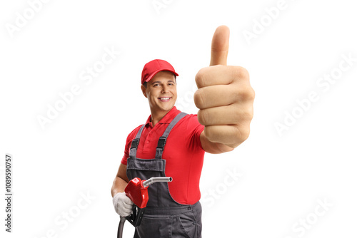 Gas station worker with a fuel hose gesturing thumbs up photo