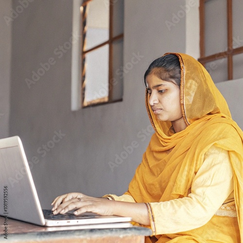 Indian poor woman using a laptop, freelancer Indian girl