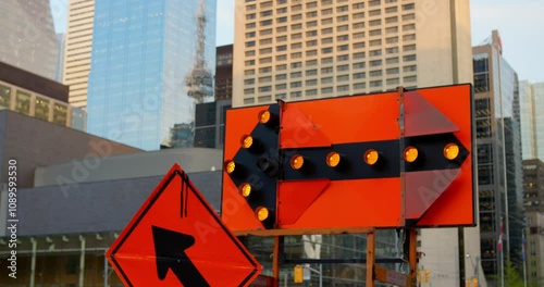 Urban roadwork scene with bright warning signs and traffic detours showcases vibrant city life, emphasizing navigation and safety in the midst of dynamic downtown construction projects.