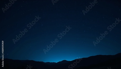 Starry night sky over mountain silhouette. photo