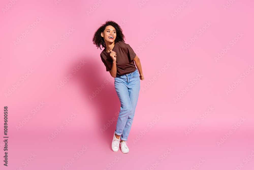 Photo of crazy cool cheerful girl wear brown trendy clothes dance look empty space isolated on pink color background Photo of crazy cool cheerful girl wear brown trendy clothes dance look empty space isolated on pink color background