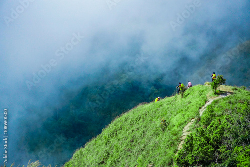 Hiking adventure with friends scenic mountain hill nature exploration cloudy environment panoramic view outdoor fun