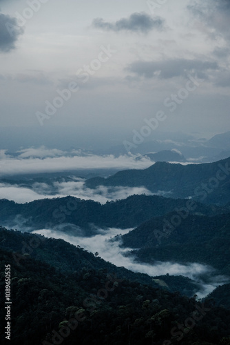 Majestic mountain range overlooking misty valleys nature landscape photography serene environment aerial perspective tranquility