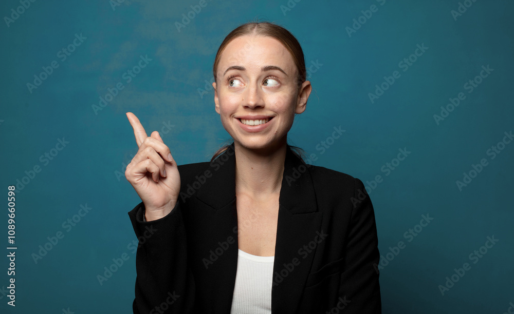 smiling happily and looking sideways, wondering, thinking or having an idea smiling happily and looking sideways, wondering, thinking or having an idea