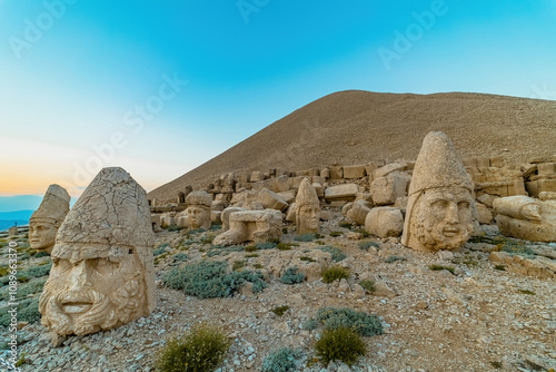 Nemrut Mountain in Adiyaman. Close-up of the giant stone head sculptures at the top of the Nemrut mountain. Adiyaman, Turkey. photo