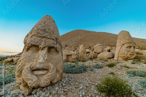 Nemrut Mountain in Adiyaman. Close-up of the giant stone head sculptures at the top of the Nemrut mountain. Adiyaman, Turkey. photo