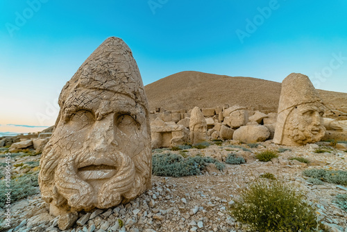 Nemrut Mountain in Adiyaman. Close-up of the giant stone head sculptures at the top of the Nemrut mountain. Adiyaman, Turkey. photo