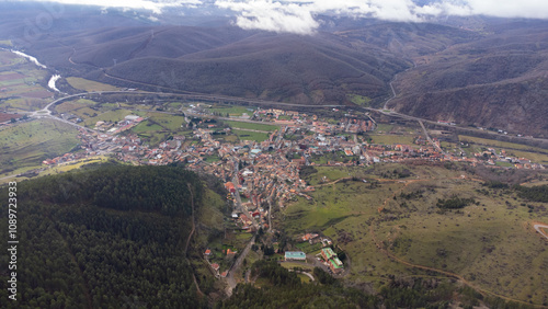 Cistierna, spain, surrounded by mountains and forests, seen from above
