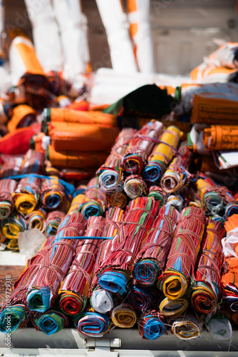 Stacks of rolled up, colorful prayerflags for sale in Mount Kailash during Saga Dawa festival , in Tibet. photo