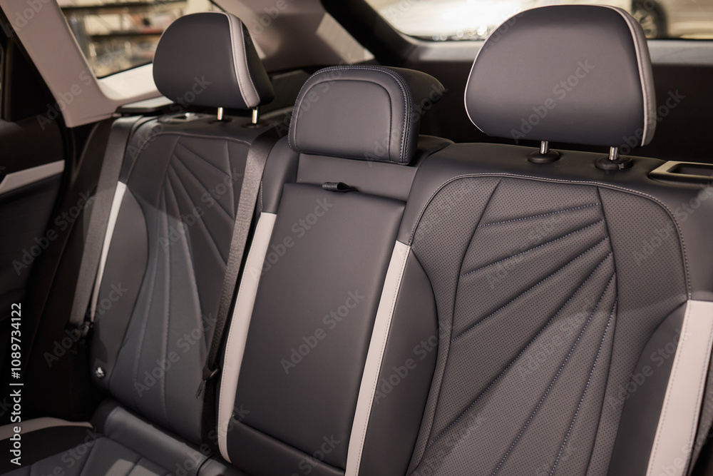 Obraz premium Car back seat with headrest and arm rest, a comfortable automotive fixture