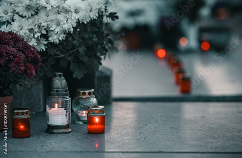 candles and flowers on a grave