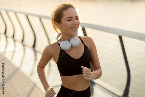 Joyful jogger enjoying a mo...