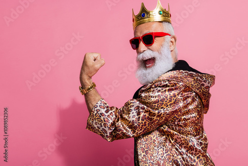 Photo of attractive grandpa winning raise fist dressed stylish leopard print garment isolated on pink color background photo