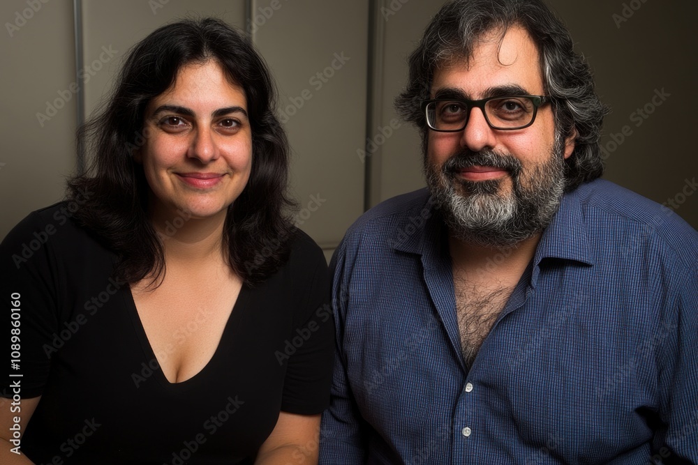 Fototapeta premium Smiling caucasian adults posing together indoors in casual attire