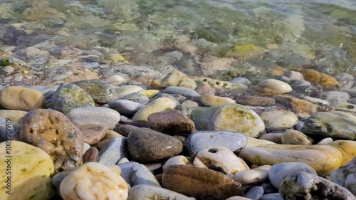 Waves and pebbles on a seashore	
