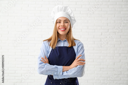 Young female chef with cros...