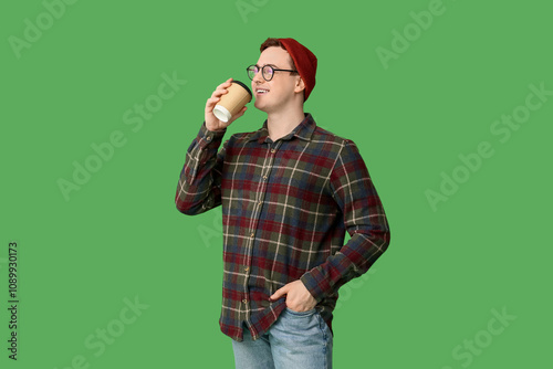 Young man in hat and with c...