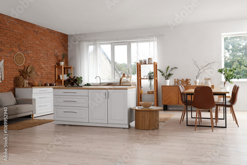 Interior of modern  kitchen with brick wall