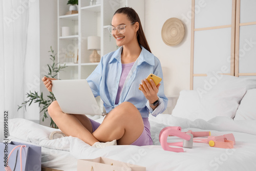 Young woman with laptop and...