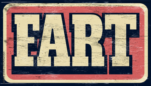 Aged and worn fart sign on wood