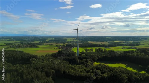 Aerial view of wind turbine in Bavaria, Ebersberg region, Germany. Luftaufnahme einer Windturbine vor dem Hintergrund der Alpen in Bayern, Deutschland. Wind turbine on golf course overlooking alps.  photo