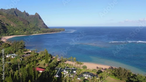 Breathtaking aerial view of Tunnels Beach in the morning, with pristine waters and clear skies surrounding Kauai photo