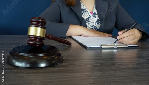 Legal counsel presents to the client a signed contract with gavel and legal law. Justice and lawyer law of advisor Concepts