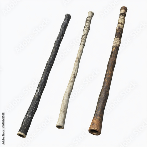 Three traditional wooden didgeridoos, a musical instrument of Indigenous Australians,  isolated on a white background. photo