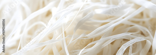 Close-up macro shot of dental floss string texture, showcasing the fine details of the floss fibers, emphasizing its strength and effectiveness in maintaining oral hygiene and healthy teeth.
