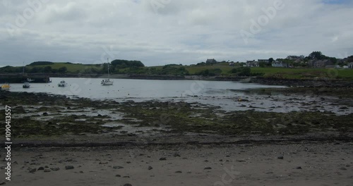 shot across Isle of Whithorn harbour at low tide photo