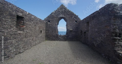 Wide shot looking at the east end window inside of St Ninian’s Chapel, Isle head, Isle of Whithorn photo