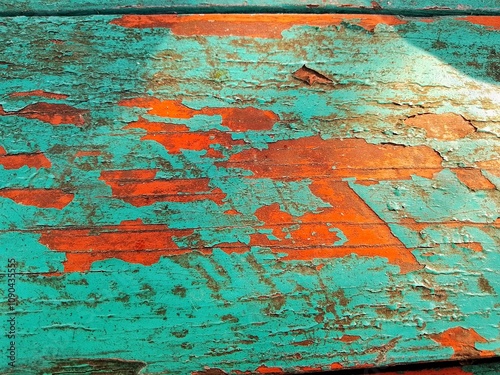 old painted wall. an old green wooden table with peeling paint