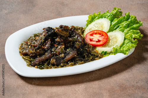 Fried eel with green chili sauce or belut goreng cabe ijo photo