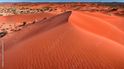 The iconic red and orange sands of the simpson desert rolling dunes under a clear sky, Ai Generated
